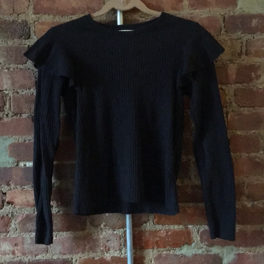 Black ribbed sweater with ruffle detail